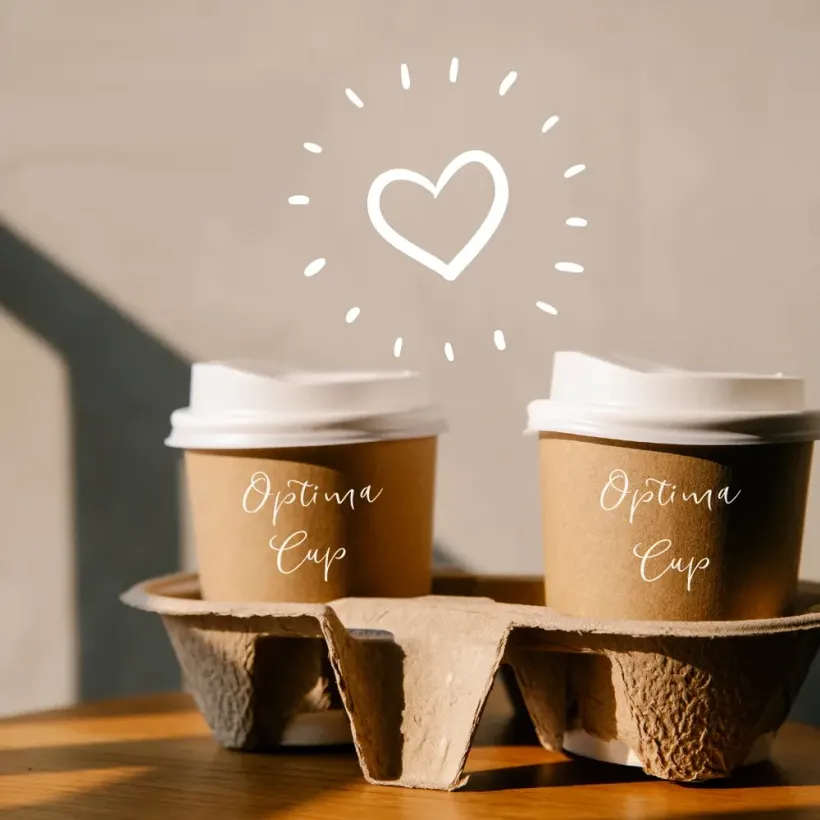Two kraft cups from a single paper cup supplier, printed with the Optima Cup name, carried in a moulded pulp two-cup tray